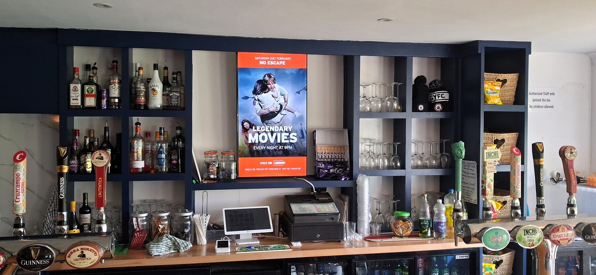 LEGEND television campaign on a portrait Grassroot Media screen integrated into a cricket clubhouse bar.
