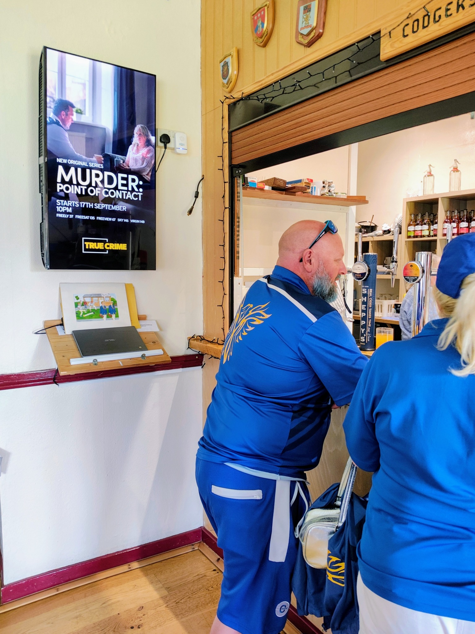 AMC True Crime campaign shown on a Grassroot Media screen inside a bowls club