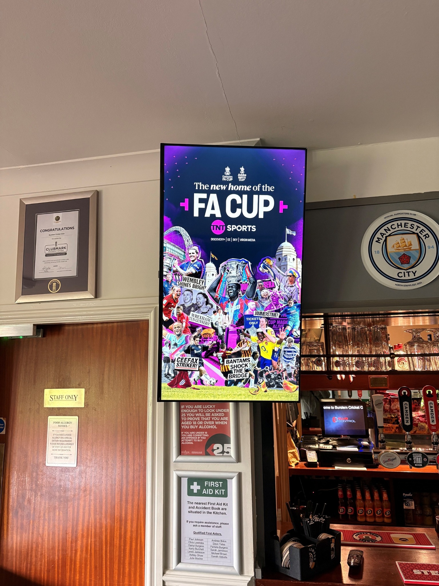 TNT Sports FA Cup campaign shown on a Grassroot Media screen inside a cricket club bar
