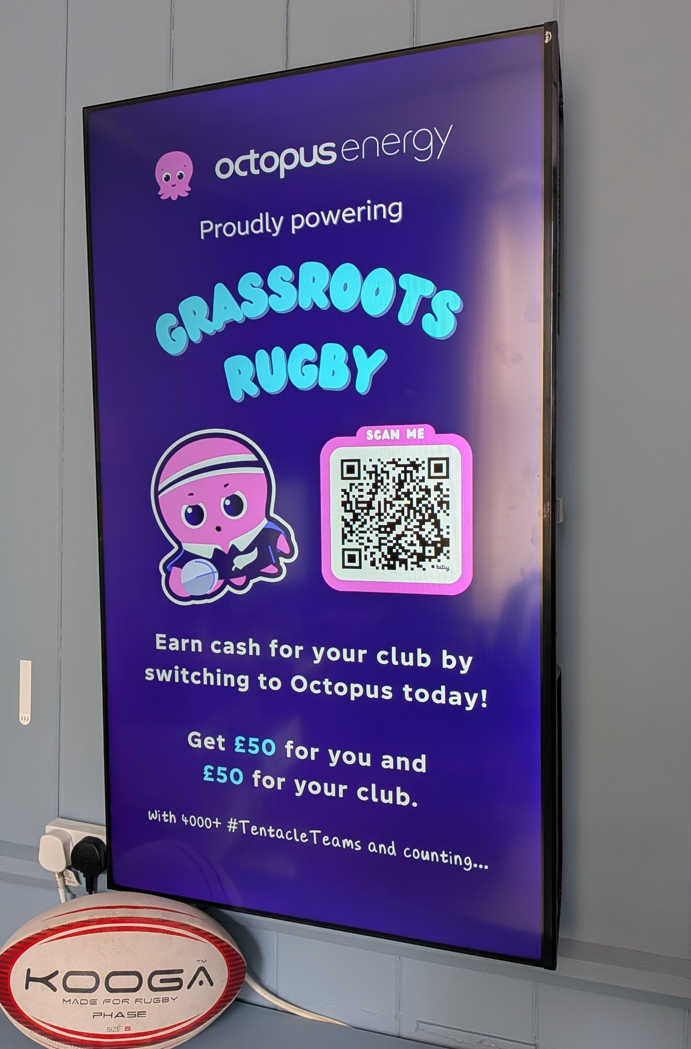 Octopus Energy campaign displayed on a clubhouse digital screen