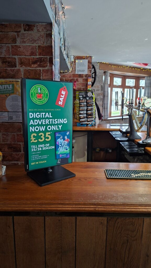 Race AFC digital screen in the bar promoting local advertising on the club screen.