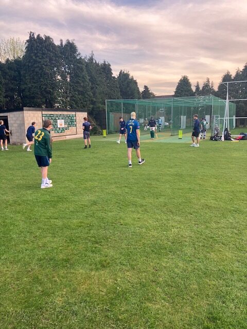 Young cricketers training beside the practice nets at Stone SP Cricket Club