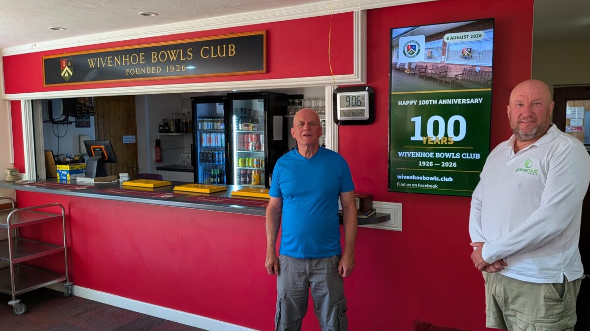 Peter Wilby of Wivenhoe Bowls Club and Mat Court of Grassroot Media beside the club’s new digital display, Grassroot Media’s 150th screen