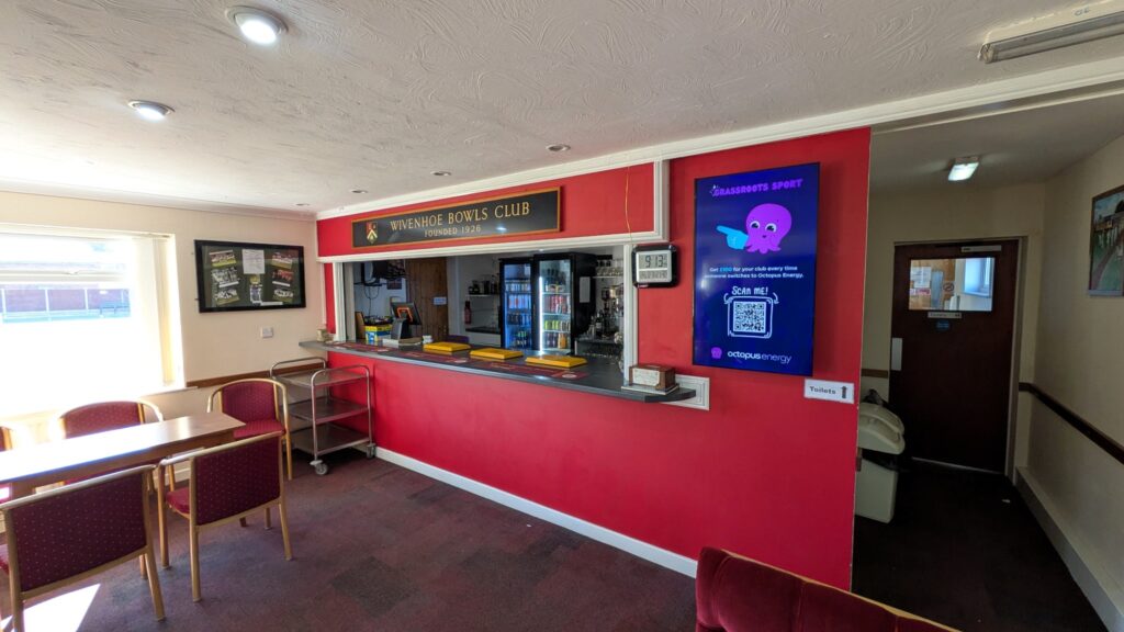 Octopus Energy grassroots sport campaign displayed on the portrait screen at Wivenhoe Bowls Club